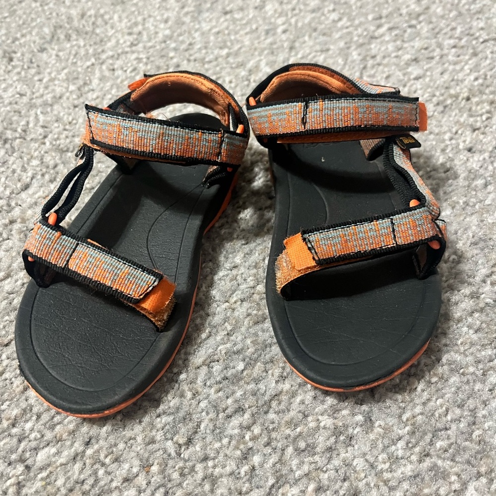 Teva Orange and Black Sandals Minimalist Design